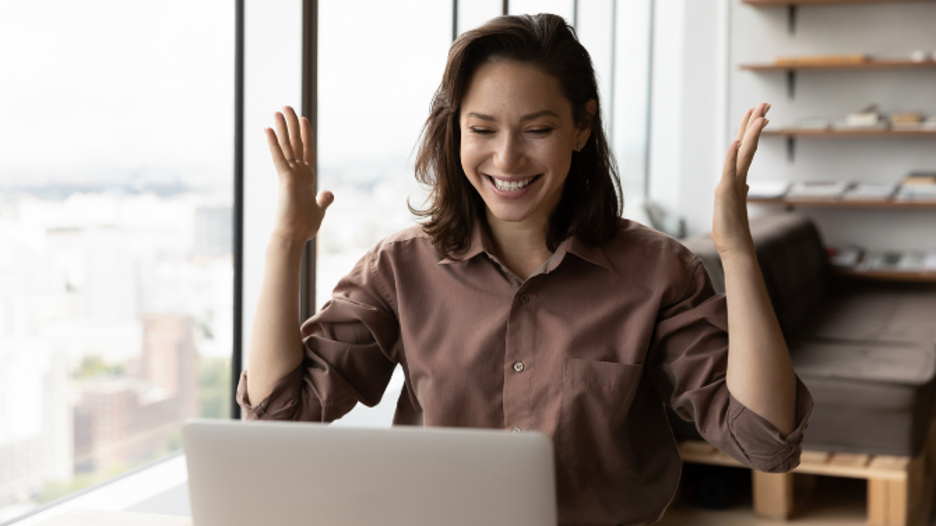 A payment processing sales agent is excited she acquired a new customer.